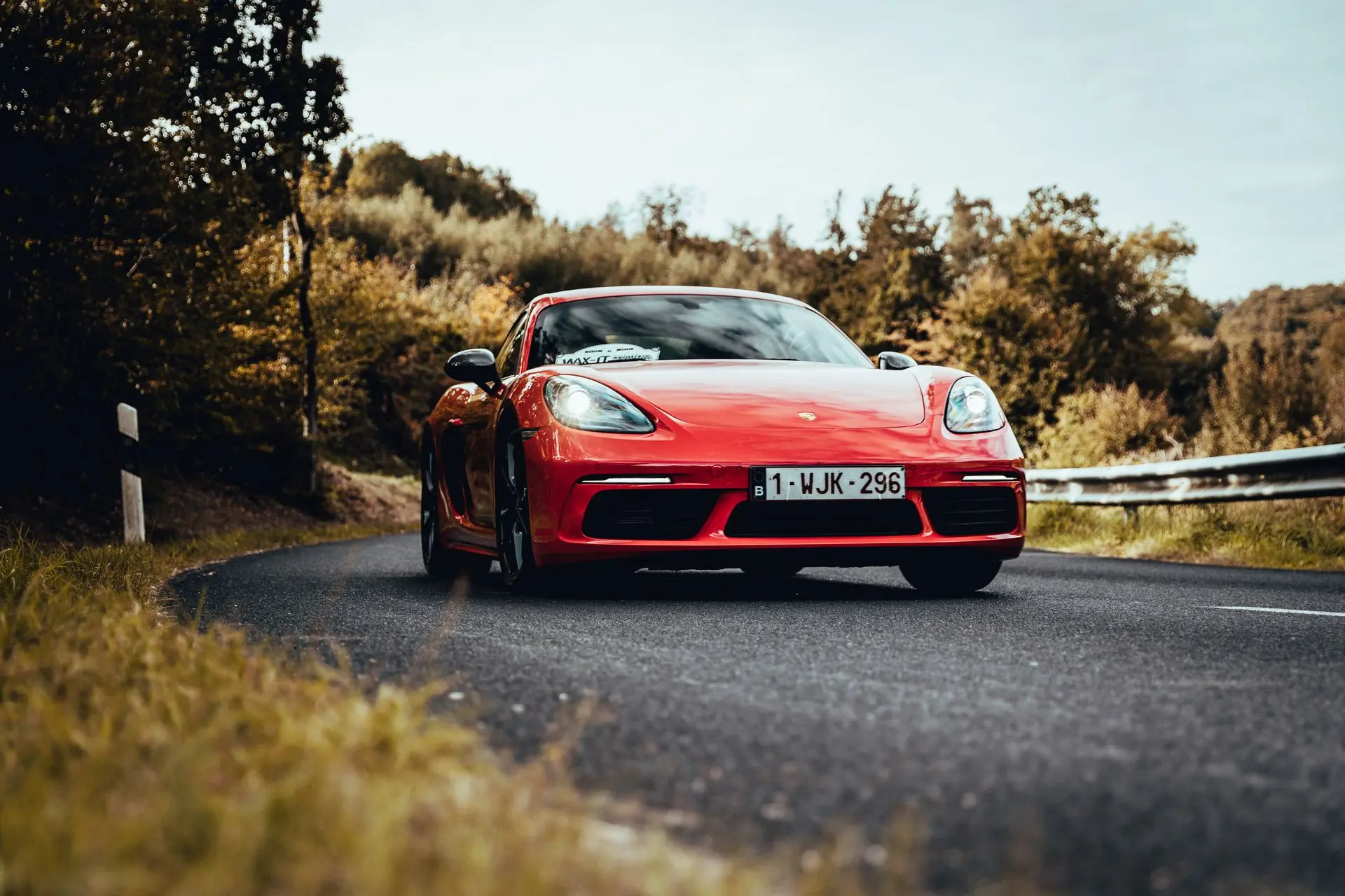 Red Porsche Cayman 1WJK296