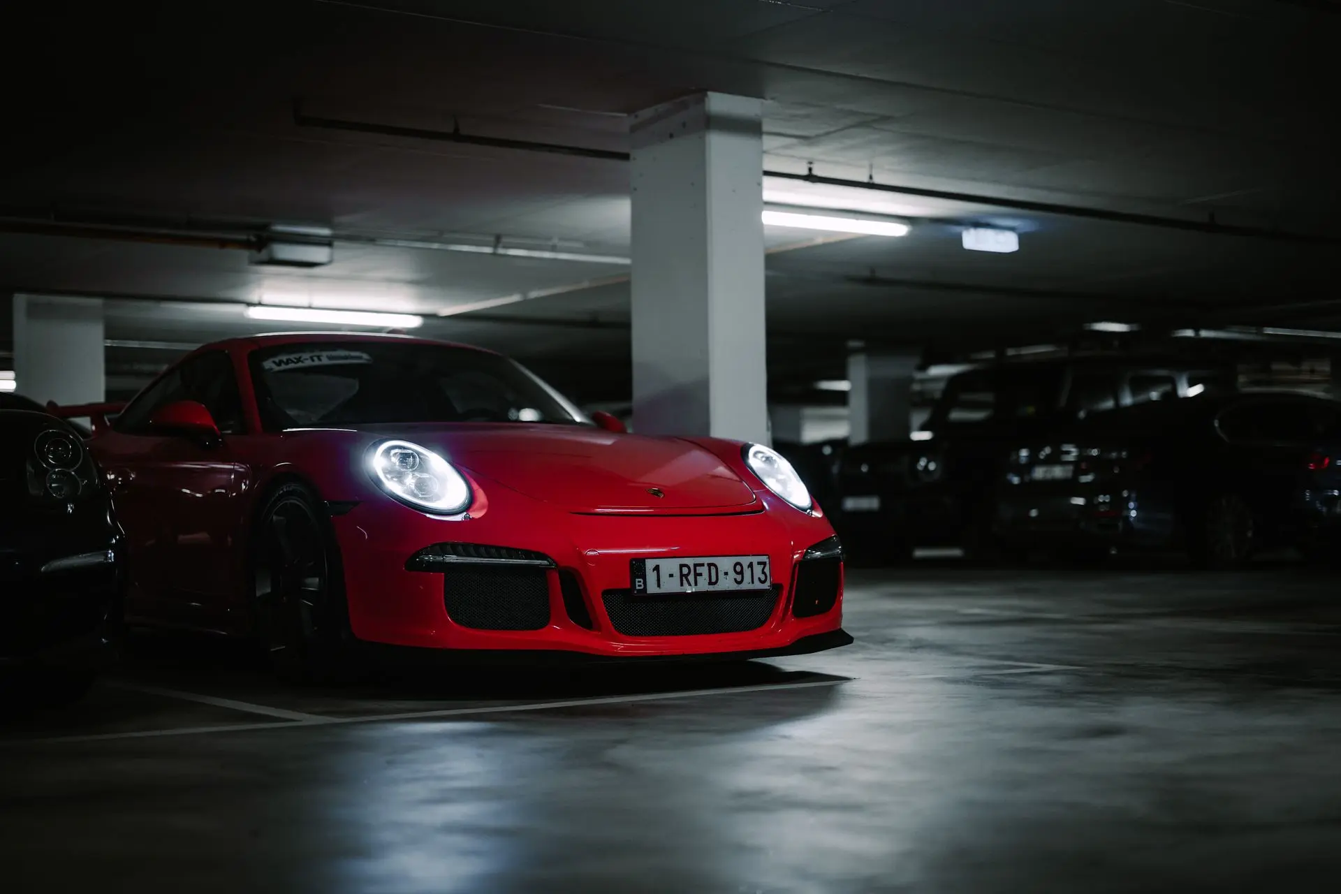 Red Porsche 911 GT3 parked underground