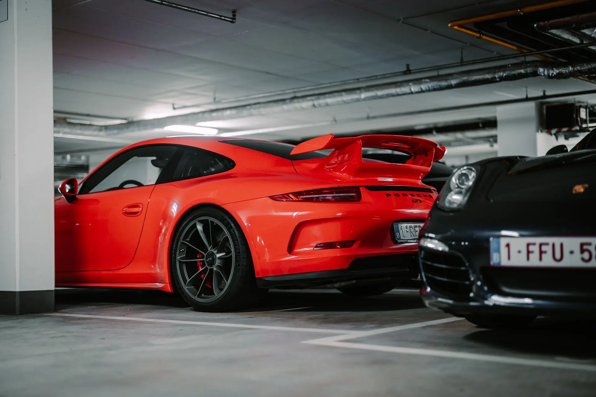 Red Porsche 911 GT3 parked underground