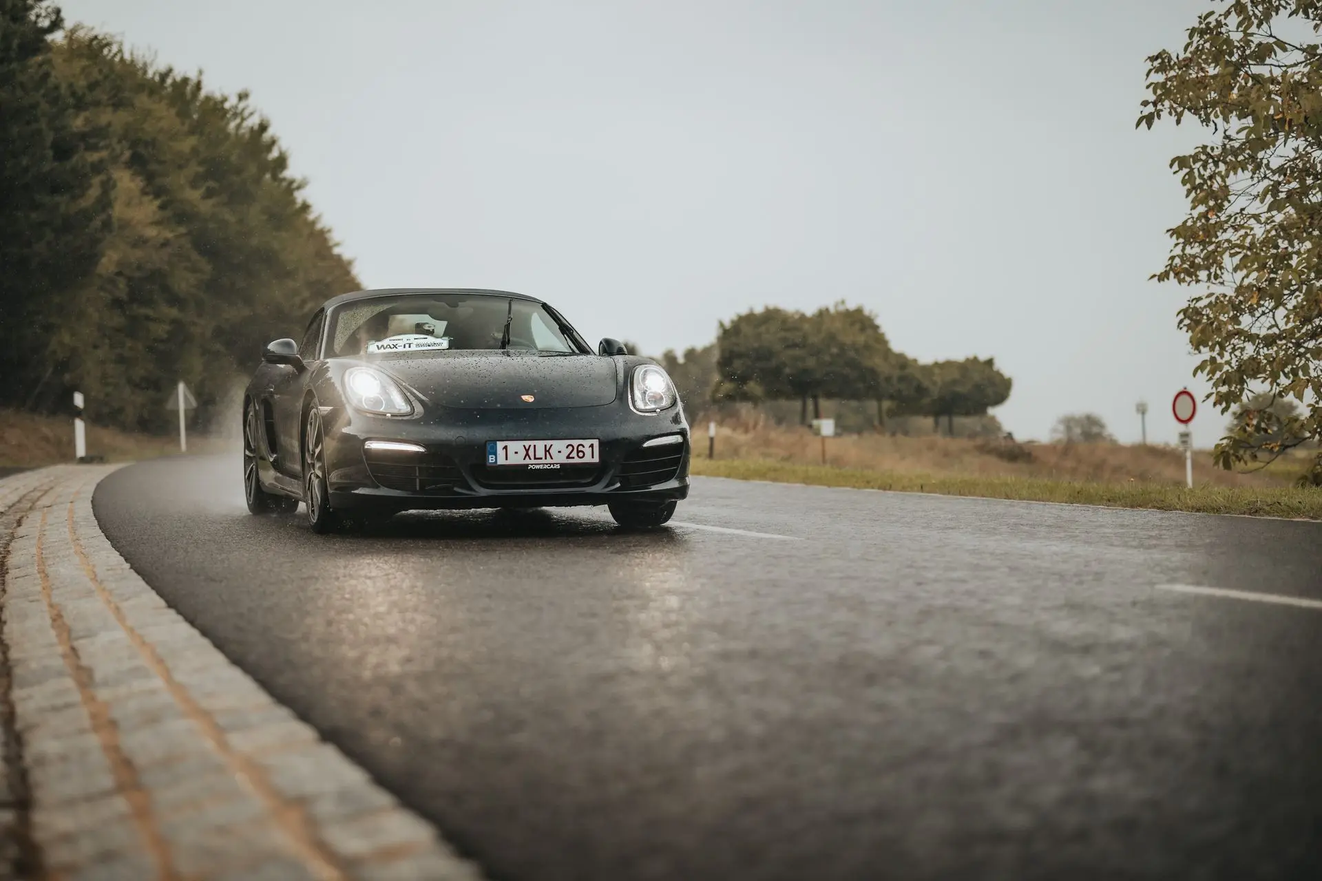Black Porsche Cayman 1XLK261