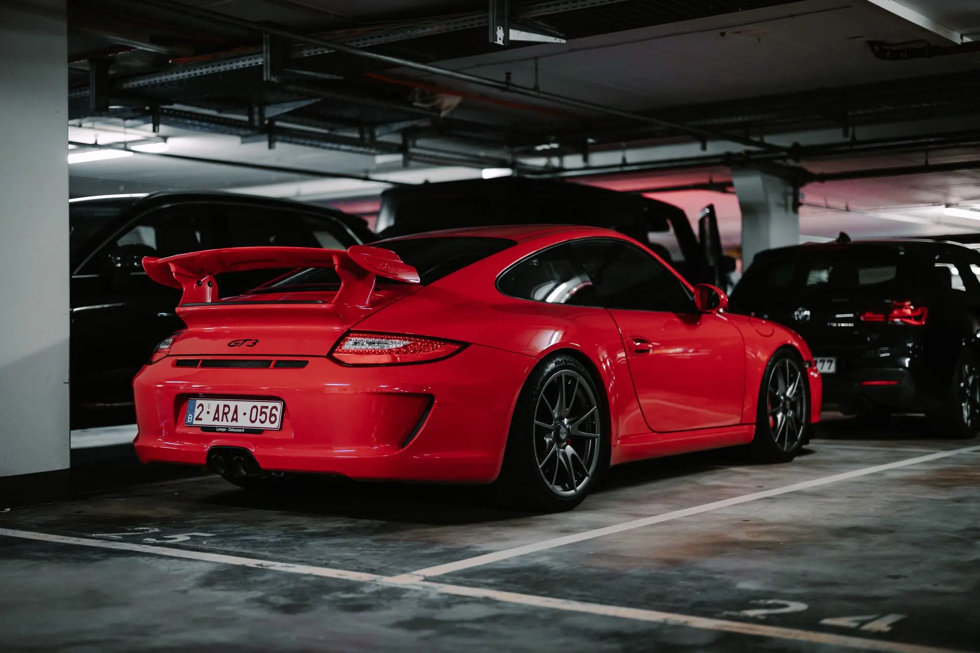 Red porsche 911 GT3 full body shot in underground parking