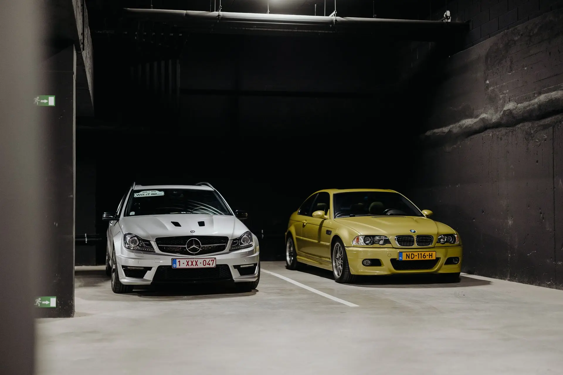 Mercedes-Benz C63 AMG parked next to yellow E46 BMW M3 Coupé